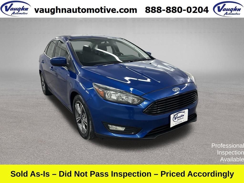 2018 Ford Focus SE in Lightning Blue — front three-quarter view