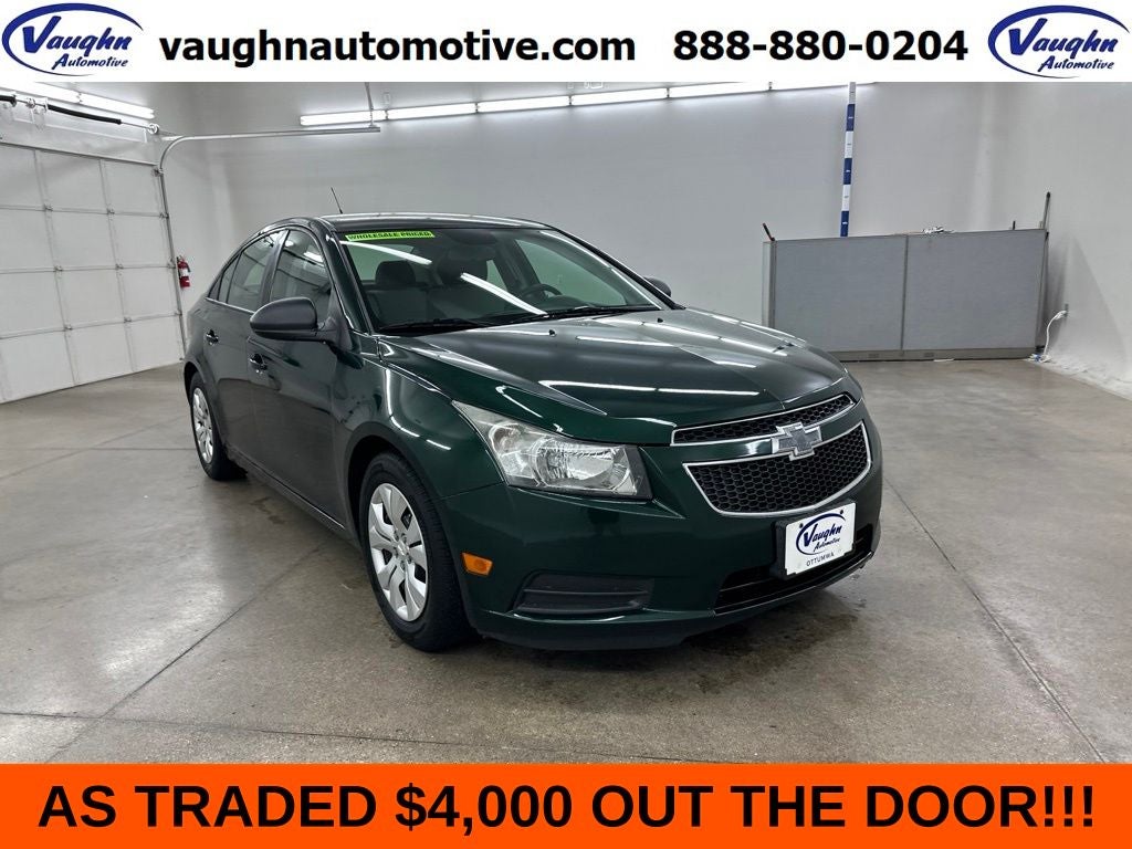 2014 Chevrolet Cruze LS in Rainforest Green Metallic — front three-quarter view